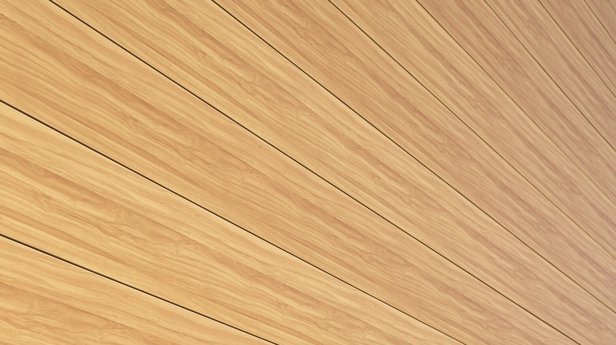 Close-up van de aluminium gevelbekleding van PREFA Siding in de kleur eiken naturel aan een eengezinswoning in Usingen, Duitsland.